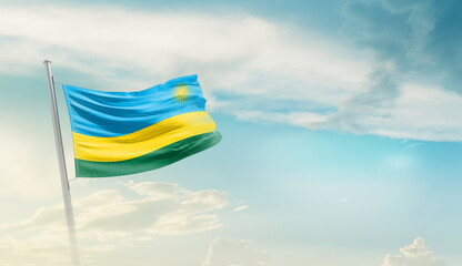 Rwanda national flag cloth fabric waving on the sky - Image - obrazy, fototapety, plakaty