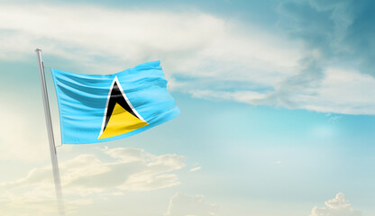 Saint Lucia national flag cloth fabric waving on the sky - Image
