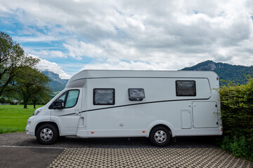 Caravan car vacation. Family vacation travel RV. Holiday trip in motorhome. Switzerland natural landscape