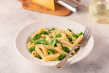 Pasta with green peas, broccoli and parmesan cheese.