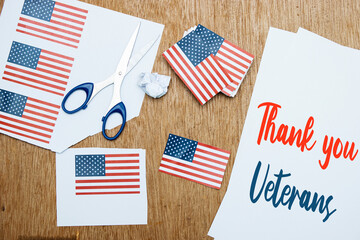 Thank You Veterans Text on paper with American Flag cards On  Wood Background for Memorial Day and Veteran's Day Holidays