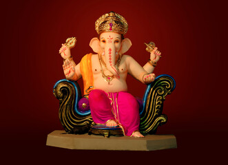 Hindu God Ganesha on colorful background, with copy space, Ganesha is the patron of arts and sciences