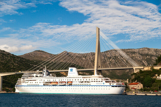 Dubrovnik, Croatia - October, 10 2019: Semester at sea World Odyssey and MSC cruise ships docked at port Gruz in Dubrovnik, under Franjo Tudjman bridge, Adriatic sea. Bright sunny day, travel concept