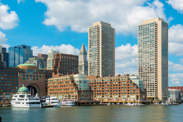 Boston Harbor view including Custom House, Rowes Wharf and modern Financial District skyline from Seaport District, city of Boston, Massachusetts MA, USA. 