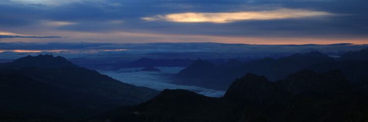 Silhouettes of Mount Pilatus, Rigi and Stanserhorn.