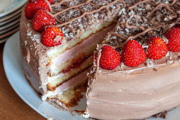 Sponge cake with strawberries. With incision inwards. High quality photo