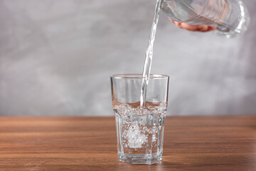 Glass of fresh water on the table.