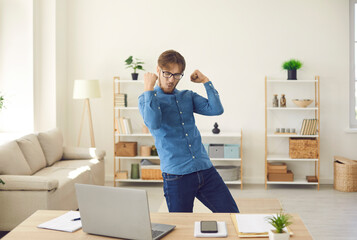 Happy excited euphoric business man or student with laptop celebrating success doing Woohoo Woo hoo...