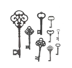 collection of ancient rusty keys isolated on white background