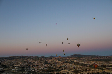 Hot air balloon over the skies of Turkey. Sunrise from a hot air balloon. View over Cappadocia and the fairy chimneys.