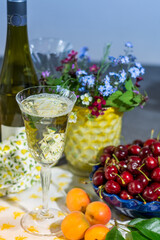 Tasting of white dry German riesling wine from Mosel river valley with summer fruits