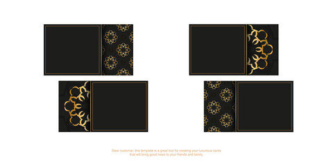 Black business card with golden mandala ornament