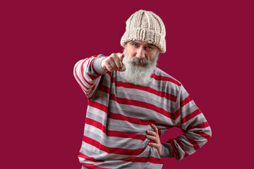 Adult handsome senior male model wearing striped sweater showing