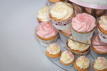 Cupcakes on a stand in the shape of a big cake for a Wedding reception