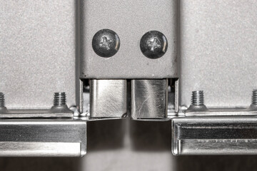 Close up shot of metal bracket joining two metal frames together