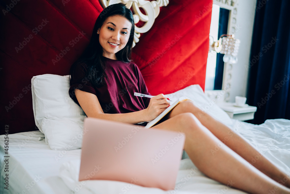 Poster happy asian student with education textbook e learning on digital laptop computer using 4g wireless 
