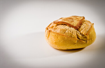 Close-up of a traditional round italian bread on white background.
