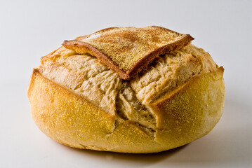 Close-up of a traditional round italian bread on white background.