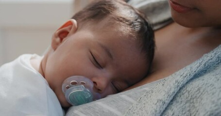 baby sleeping peacefully in mothers arms loving mother holding infant caring for sleepy toddler at home 4k - Powered by Adobe