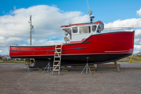 Fishing Boat on a Dry Dock - Fishing boat on dry dock in a rural fishing community in the Atlantic coast of Nova Scotia in early autumn.