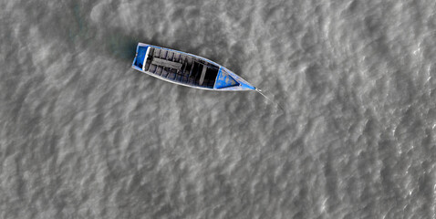 Little blue fishing boat on the Atlantic ocean 