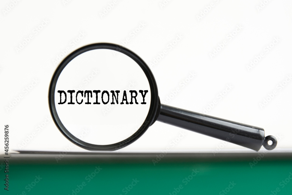 Poster magnifying glass with text dictionary on notebook