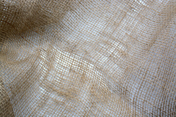 Burlap crumpled texture background brown, woven, close-up