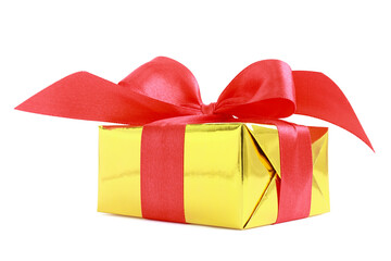 Yellow glossy gift wrapped present with red satin bow, isolated on white