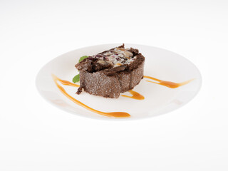 A piece of chocolate roll on a white background. Sweet dessert.