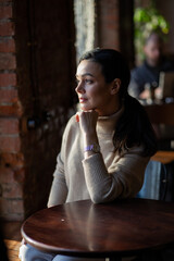 woman drinking coffee in cafe