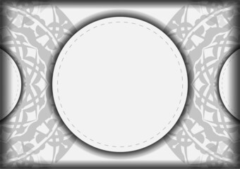 Invitation template with a place for your text and Greek ornaments. Ready-to-print postcard design White colors with black mandala patterns.