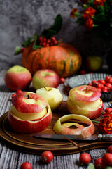 Vertical autumn composition. Close-up of juicy red apples on a dark gray background