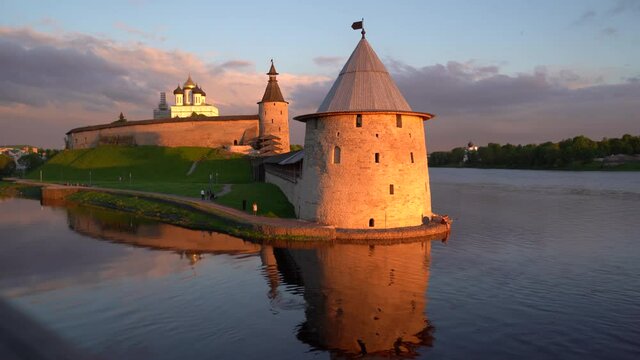 Pskov Kremlin, Russia, at sunset, illuminated by the rays of the sun, at the confluence of two rivers, the Great and Pskov. Timelapse video.