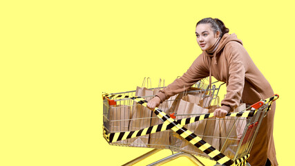 Black Friday, a girl tries to break a black and yellow ribbon on supermarket carts