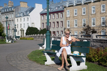 Women reading a book and relaxing in a park