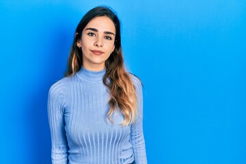 Obraz premium Young hispanic girl wearing casual clothes relaxed with serious expression on face. simple and natural looking at the camera.