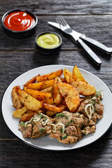 Grilled Pork Shoulder Steaks with potato wedges