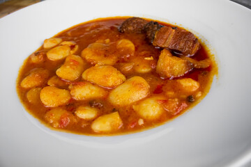 Closeup of a typical Spanish Asturian fabada with chorizo served on a plate