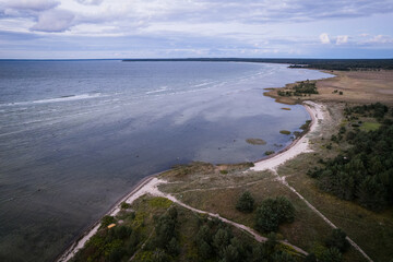 Aerial drone view over northern evening coastline of Baltic Sea. Summer nature beach in Estonia.