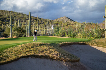 Woman playing golf in Tucson Arizona