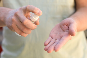 hand disinfection with an antiseptic spray as prevention of coronavirus - Image
