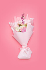 bouquet of flowers on pink background  - image