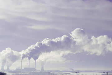 Smoke from the chimney in winter city. Air pollution and ecology.