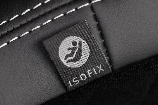 SOFIX sign on black leather background. ISOFIX for child car seats- Image