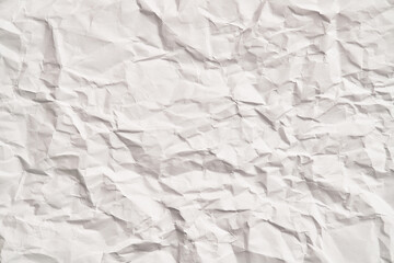 White crumpled paper texture with wrinkles. Damaged and torn sheet