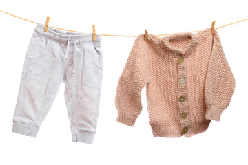 Baby clothes on a clothesline on white  background