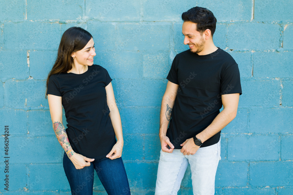 Wall mural Girlfriend and boyfriend with custom print t-shirts