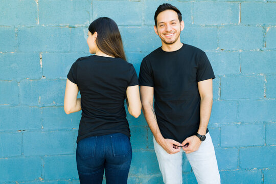 Young woman and man with custom print t-shirts