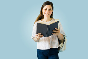 Cheerful woman reading her favorite book