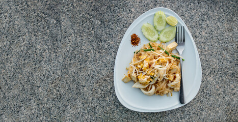 Asian seafood pasta with tropic fresh juice cocktails served on granite tabletop, copyspace. Top view